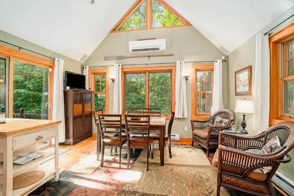 a dining room with a table and chairs at The Stonewater Lodge in Traverse City