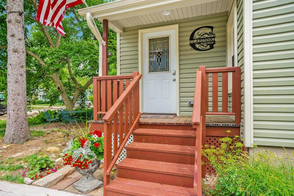 a house with an american flag on the front door at South Haven Heaven in South Haven