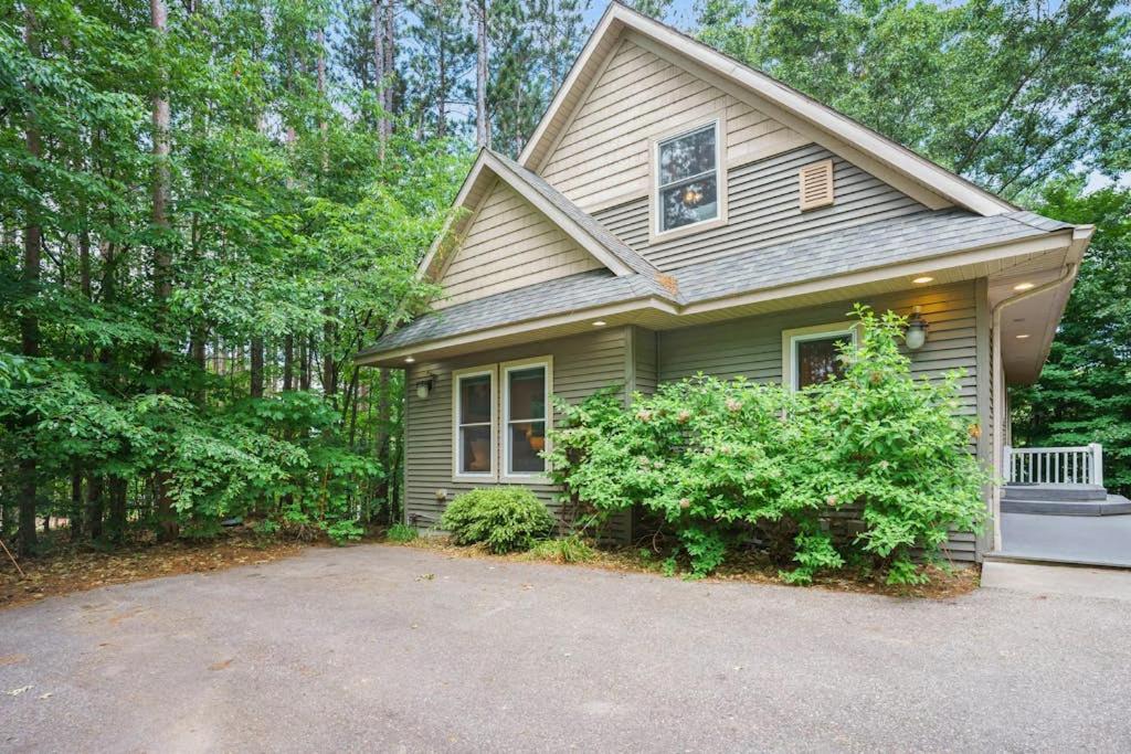 a house with a driveway in front of it at Beach House in Saugatuck