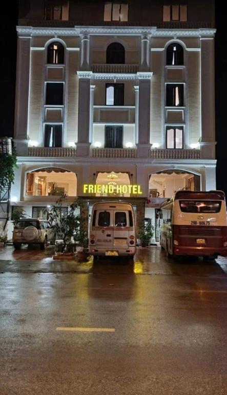 a hotel with a van parked in front of it at Friend Hotel Hà Giang in Ha Giang