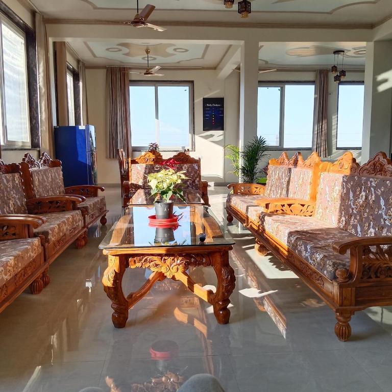 a living room with couches and a coffee table at Thano Retreat in Dehradun