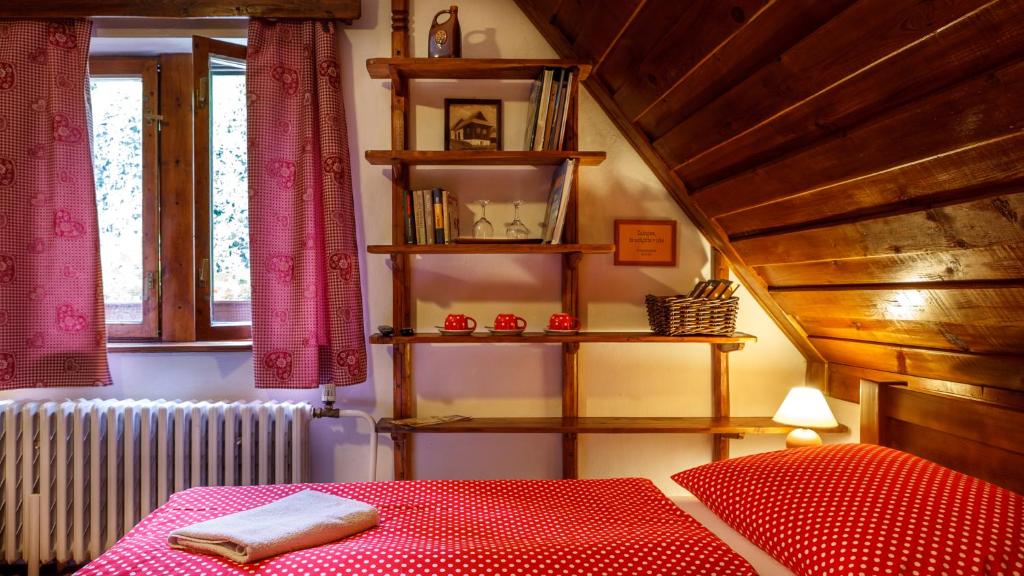 A bed or beds in a room at Penzion Barborka