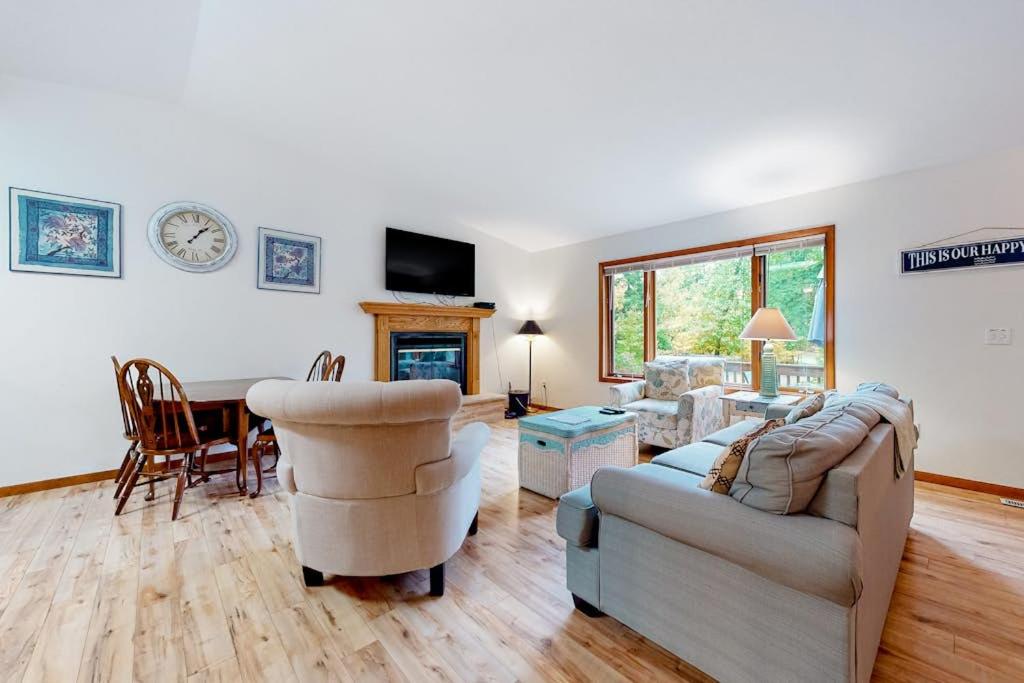 a living room with a couch and a table at Dunes Trail in Glen Arbor