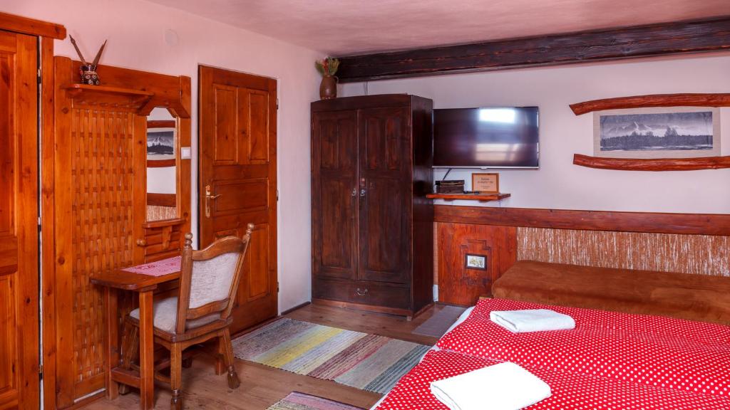 A bed or beds in a room at Penzion Barborka
