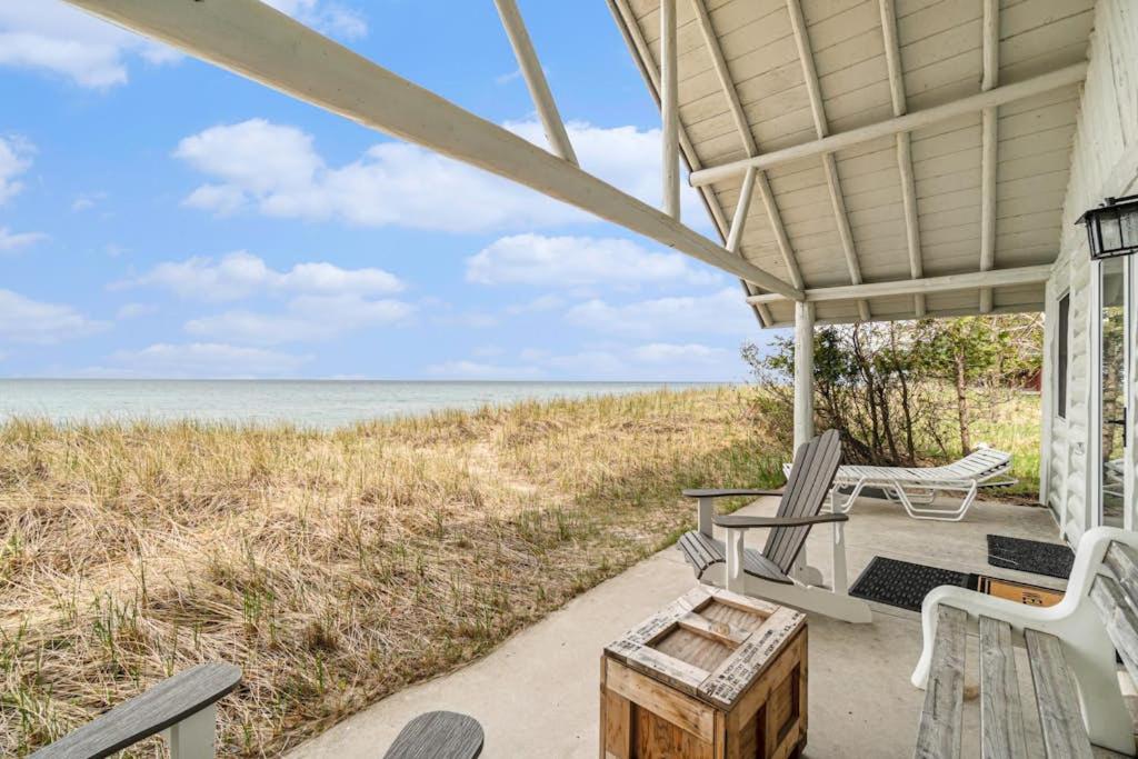 a porch with chairs and a view of the ocean at Cedar Crest in Empire