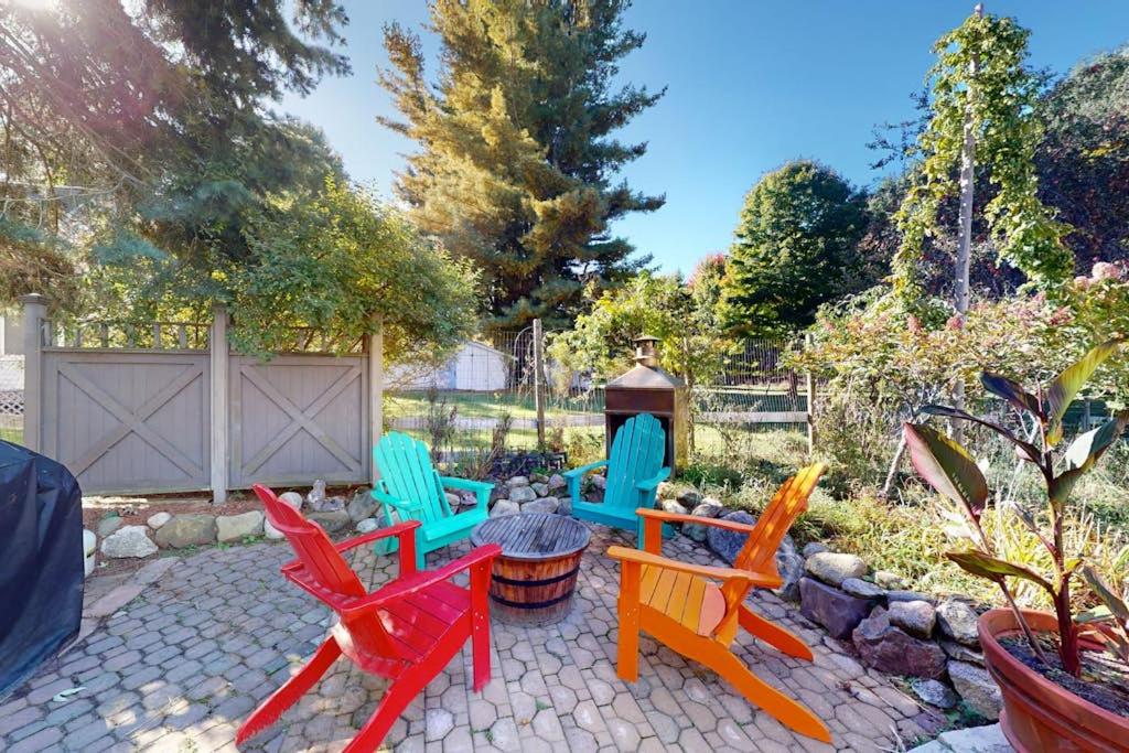 a patio with colorful chairs and a table at Empire Lodge in Empire