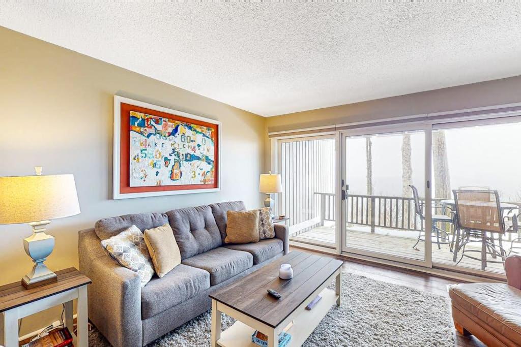 a living room with a couch and a table at Ship Watch 15 in Glen Arbor