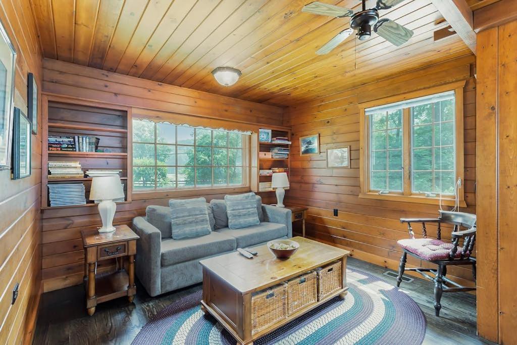 a living room with a couch and a table at Peterson Mill in Saugatuck