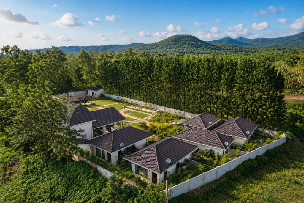 an aerial view of a house in the mountains at The Pentouz Hillside Chikmagalur in Chikmagalūr