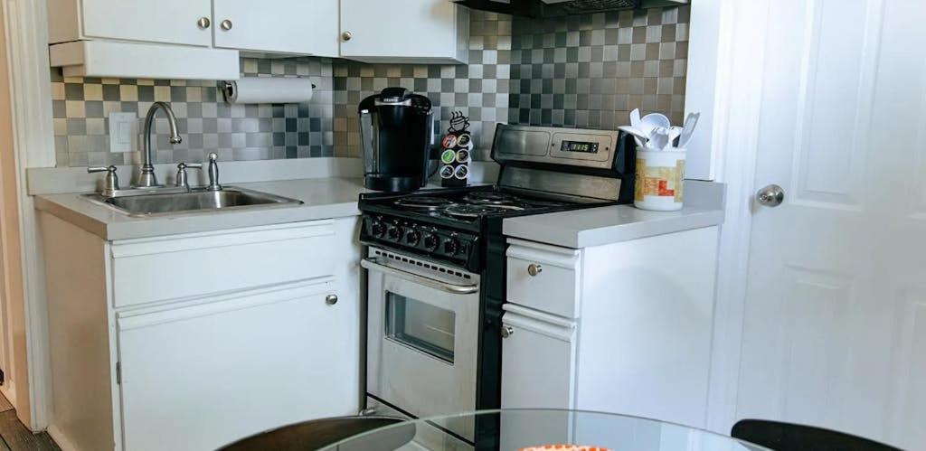 a kitchen with a stove and a sink at Myles Standish in Provincetown