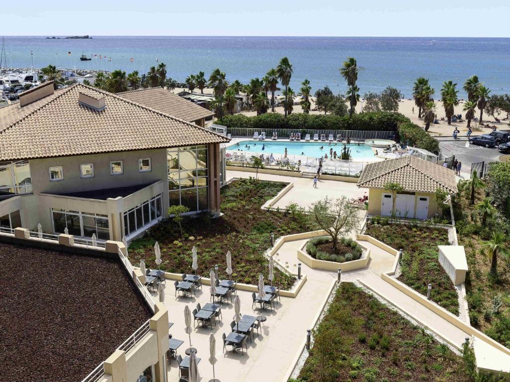 an aerial view of a resort with a swimming pool at Mercure Thalasso & Spa Port Fréjus in Fréjus