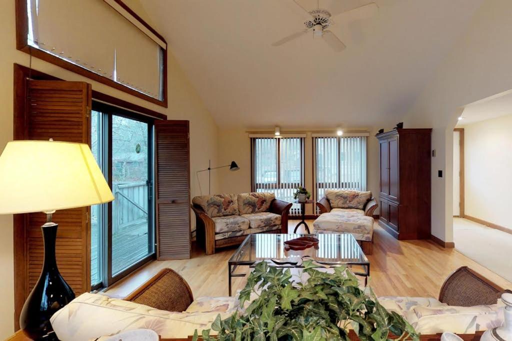 a living room with a couch and a table at Island Getaway in Oak Bluffs