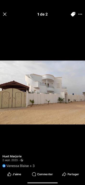 a picture of a white house in the desert at villa baya midoun in Midoun