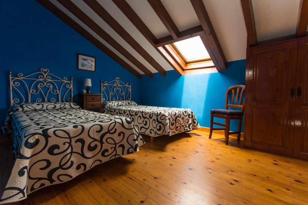 A bed or beds in a room at Apartamentos Rurales Playa del Canal