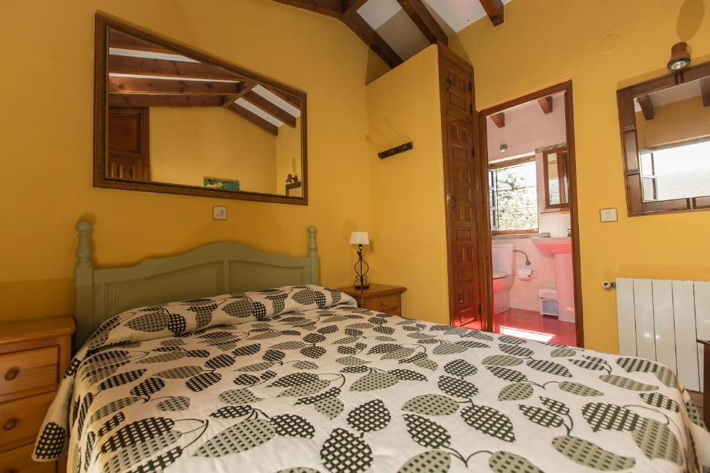 A bed or beds in a room at Apartamentos Rurales Playa del Canal