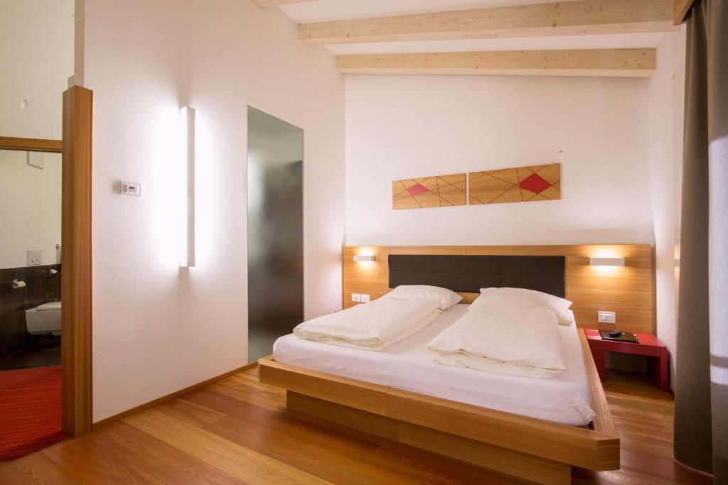 Postel nebo postele na pokoji v ubytování Hotel Al Cervo