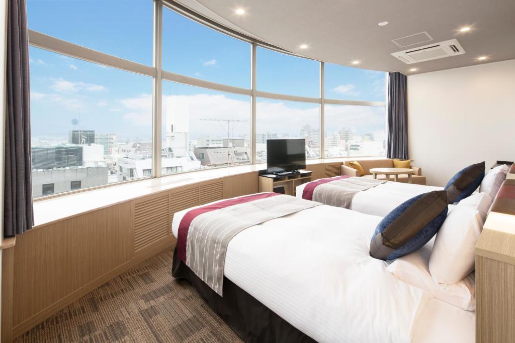 Postel nebo postele na pokoji v ubytování HOTEL MYSTAYS Tachikawa