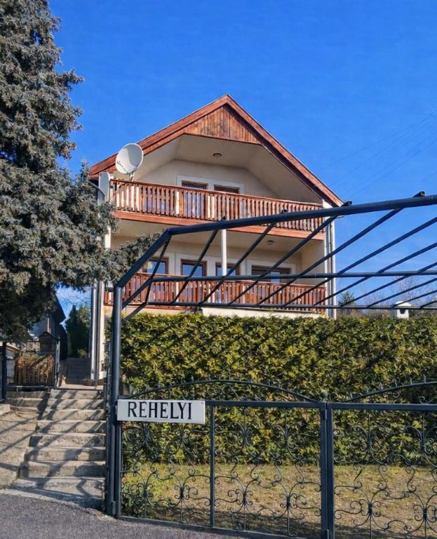 a house with a sign in front of it at Réhelyi in Szigliget