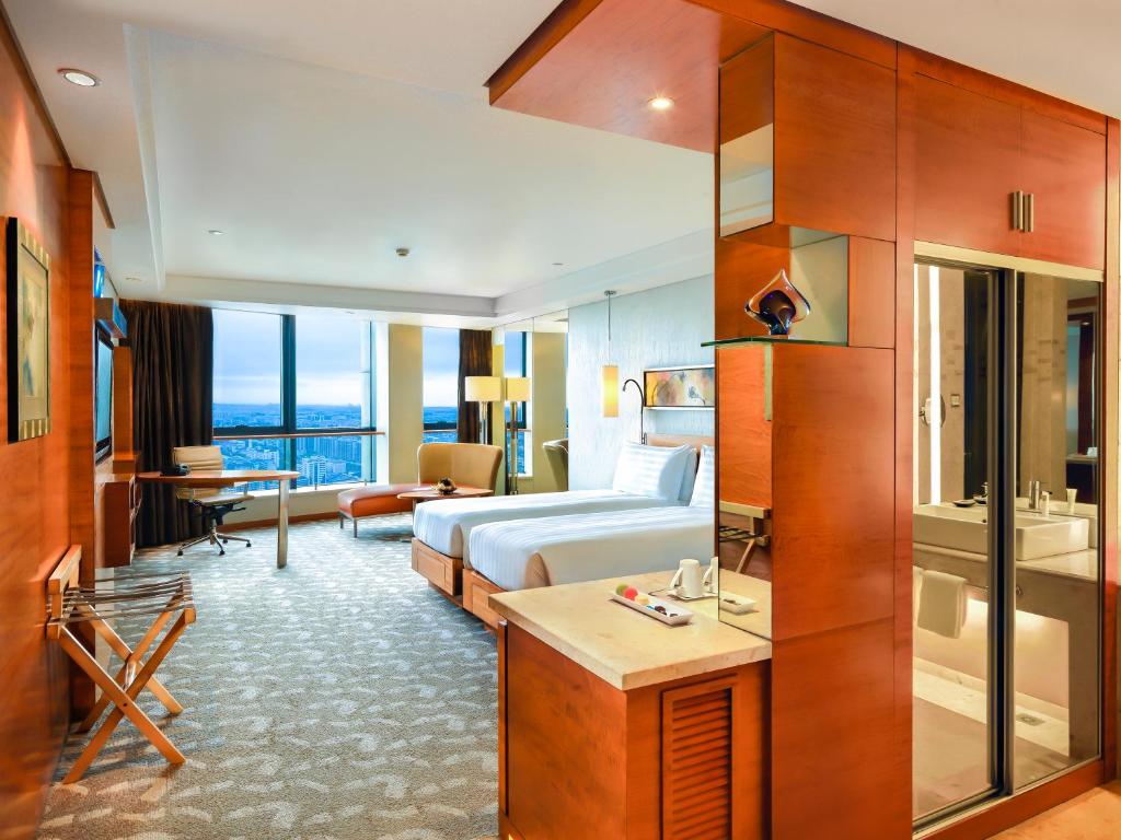 Postel nebo postele na pokoji v ubytování Swissotel Foshan, Guangdong - Free shuttle to Canton Fair