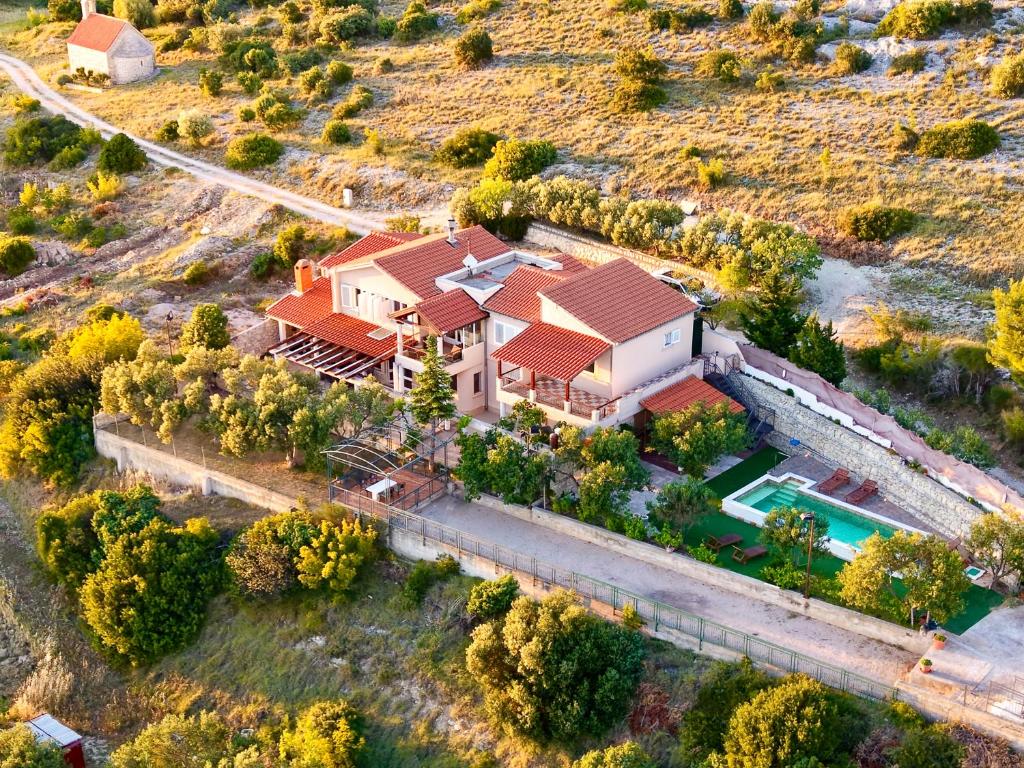 an aerial view of a house with a pool at Villa Serenity in Šibenik