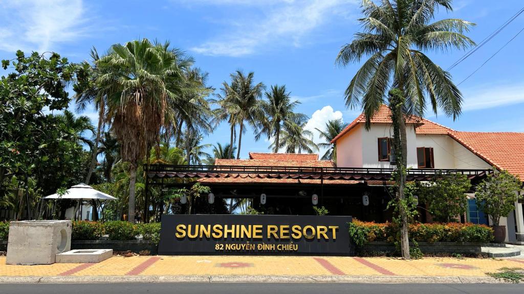 a sun shine resort sign in front of a building at SUNSHINE BEACH Resort in Mui Ne