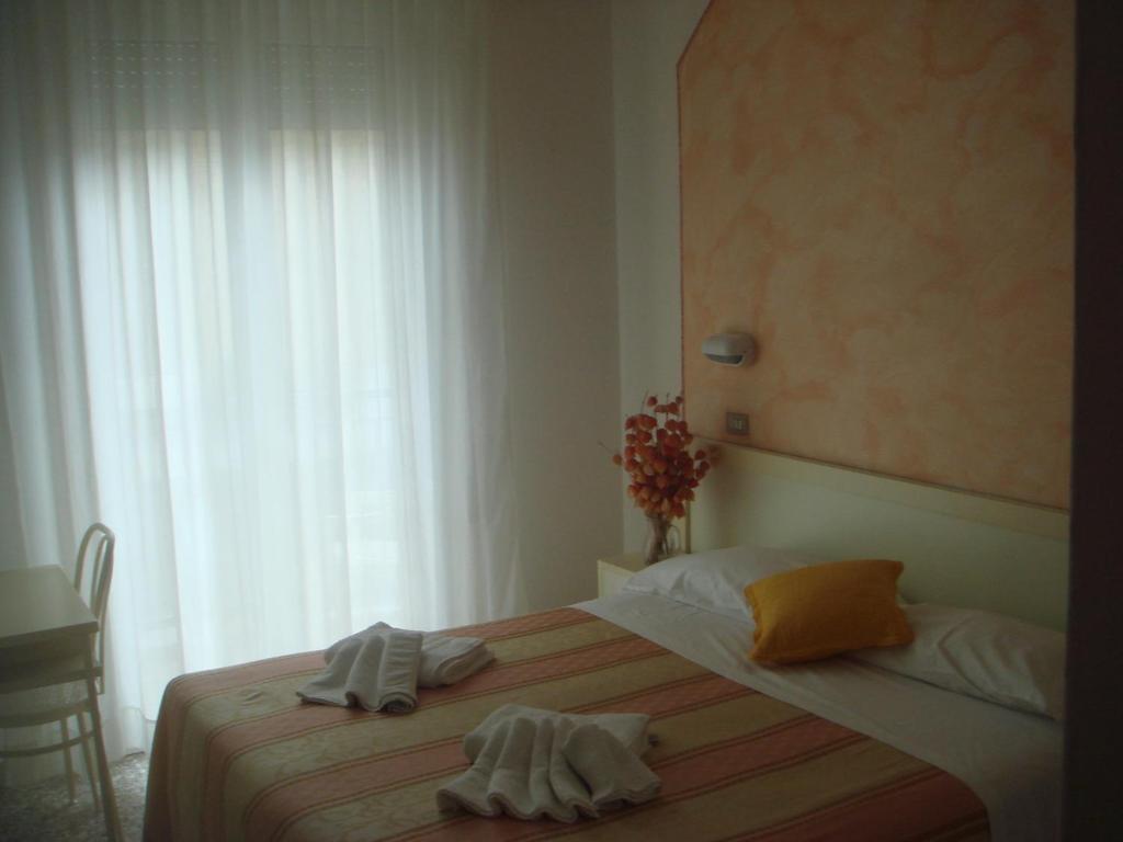 Postel nebo postele na pokoji v ubytování Hotel Arcade