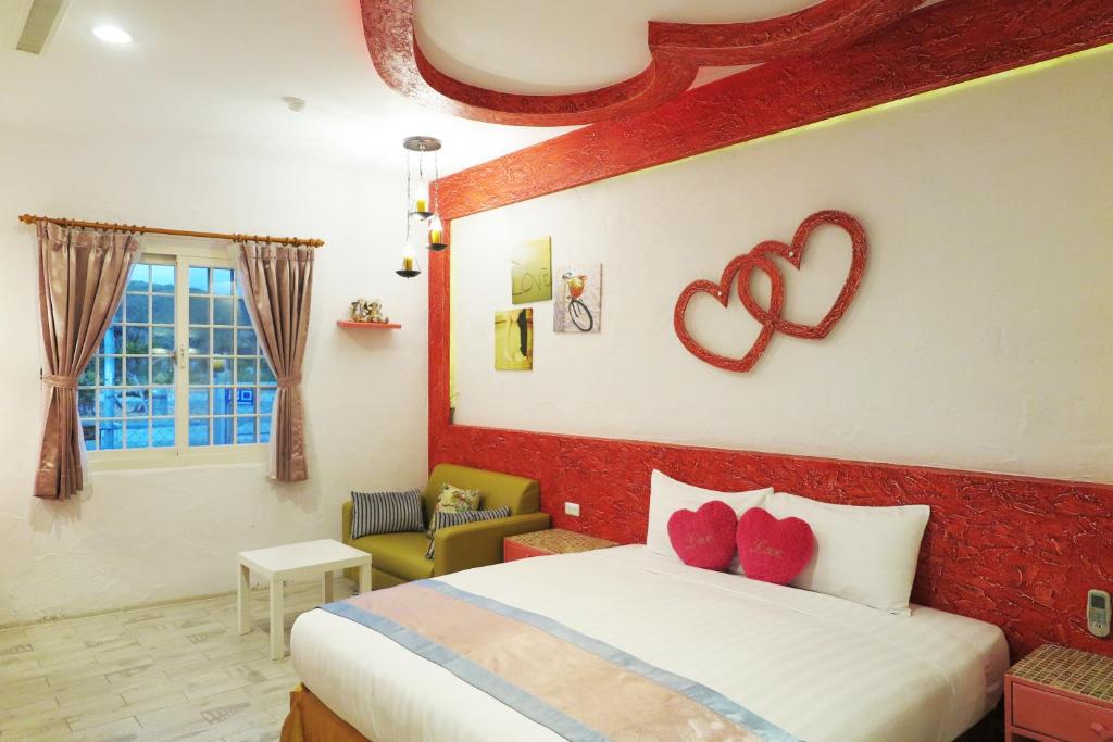 Postel nebo postele na pokoji v ubytování Kenting Sin Sin Hotel IIl