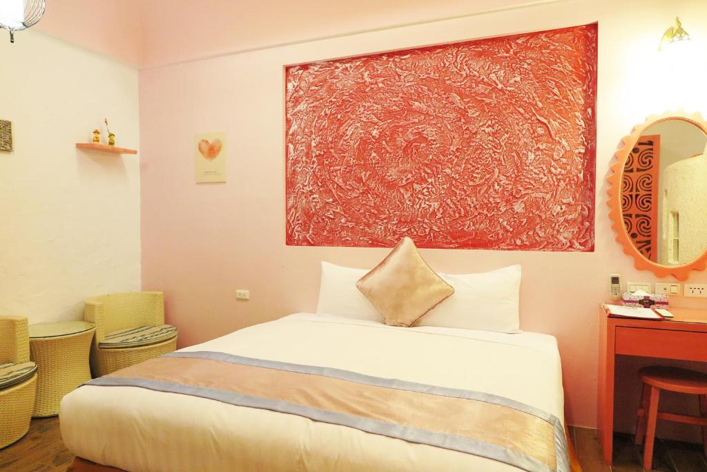 Postel nebo postele na pokoji v ubytování Kenting Sin Sin Hotel IIl