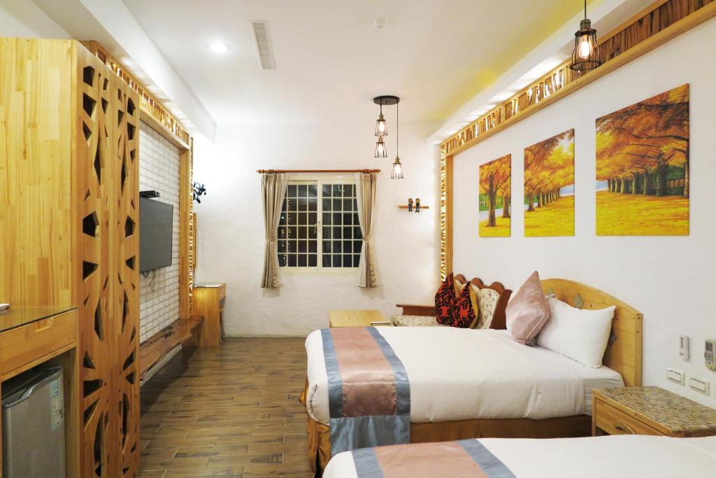 Postel nebo postele na pokoji v ubytování Kenting Sin Sin Hotel IIl