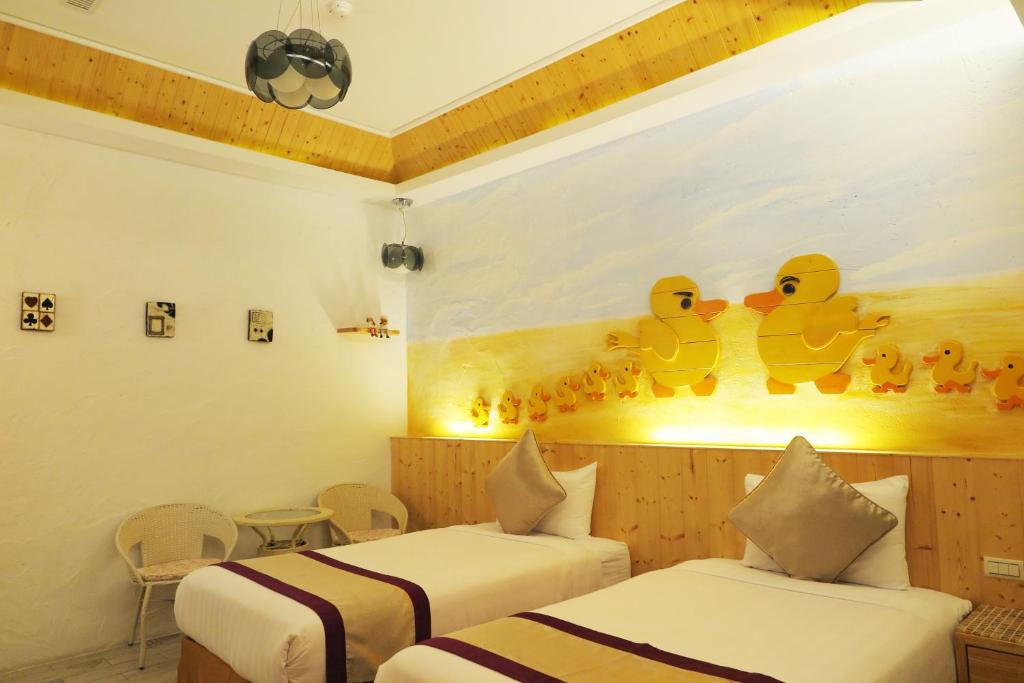 Postel nebo postele na pokoji v ubytování Kenting Sin Sin Hotel IIl
