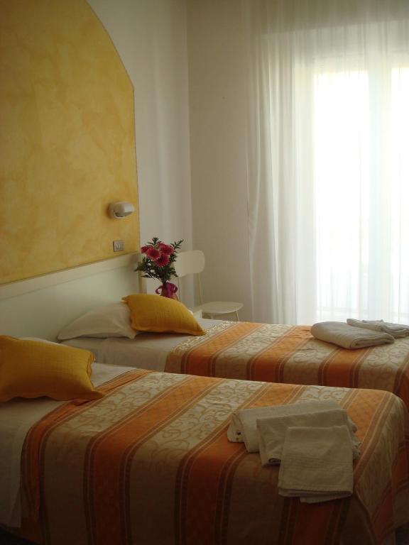 Postel nebo postele na pokoji v ubytování Hotel Arcade