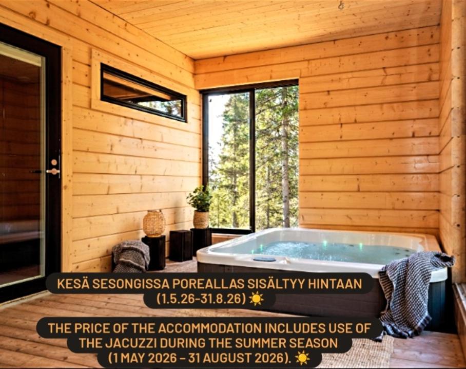 a building with a jacuzzi tub in a room at Villa Huikonen in Syöte