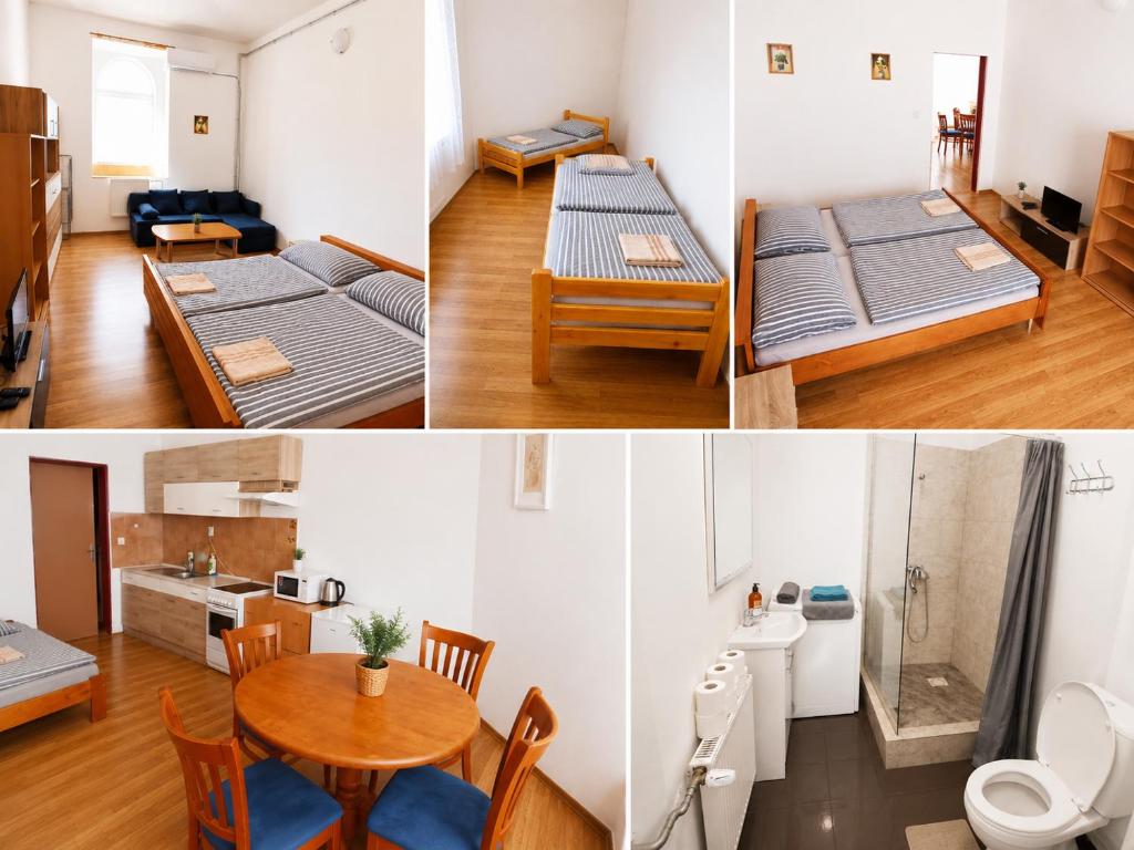 a room with two beds and a dining room with a table at Apartmány Pražská in Ústí nad Labem