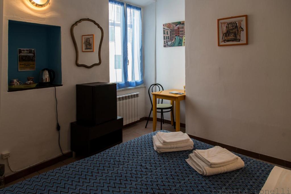 Postel nebo postele na pokoji v ubytování Camere Anna