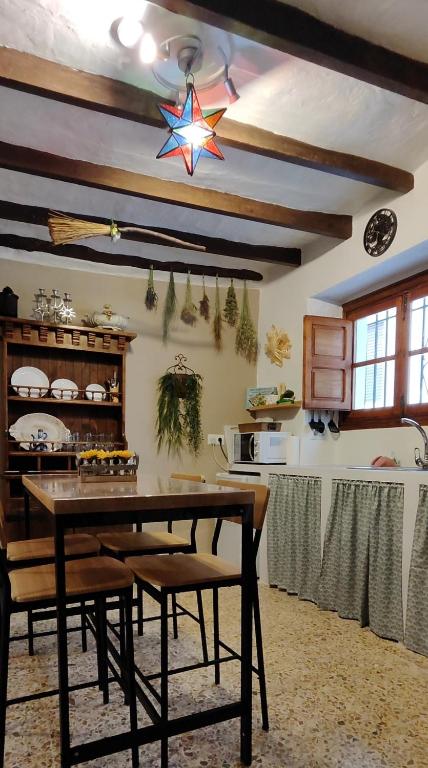 a dining room with a table and a star on the ceiling at El Rincón de la Magia in Soportújar