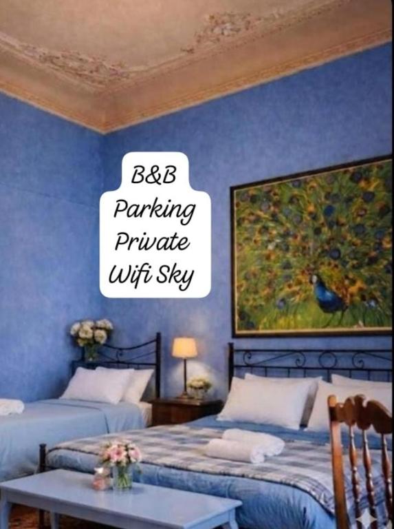 a bedroom with two beds and a sign that reads bba parking private writt at B&B Amarantha Gothica Genoa in Genoa