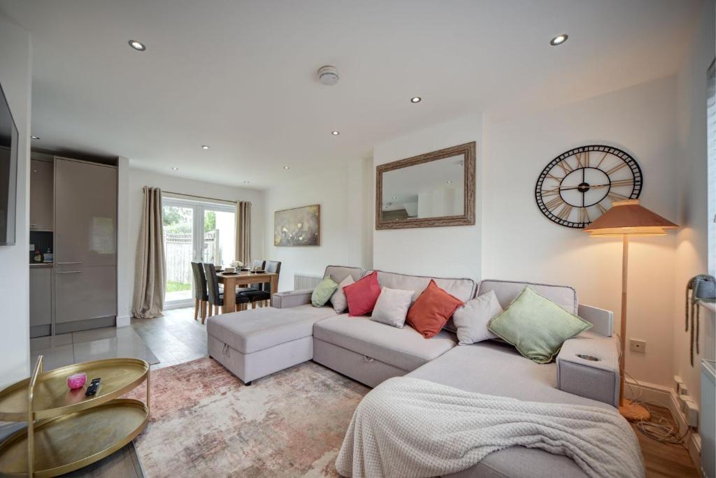 a living room with a couch and a table at The Chislehurst Hideaway in Chislehurst