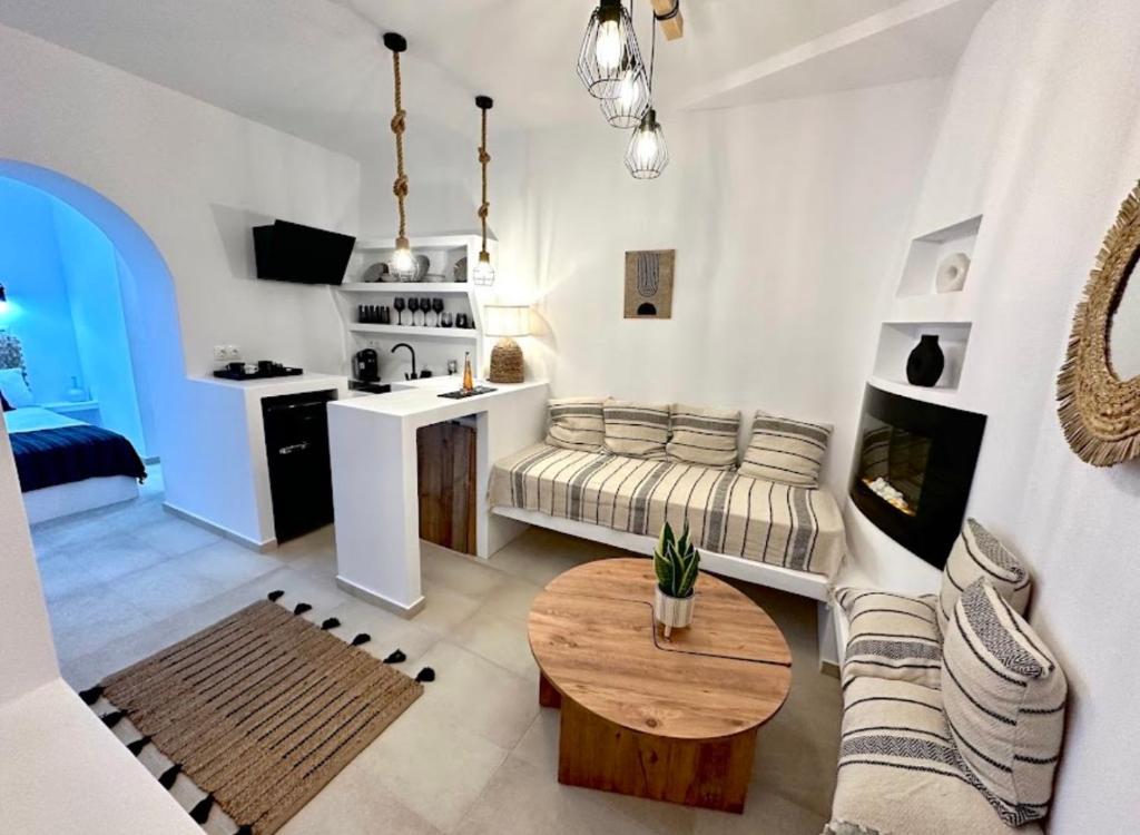 a living room with a couch and a table at Babatseratsi 3 Apartment in Skiros