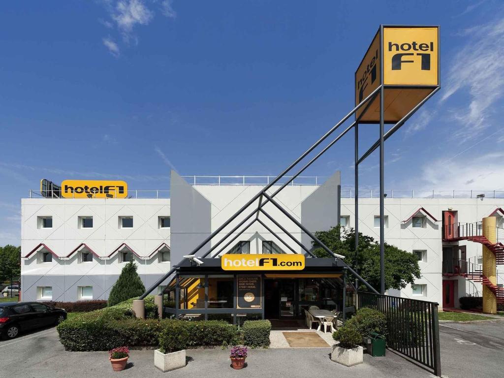 a hotel front with a sign in front of it at hotelF1 Evreux Sud in Évreux