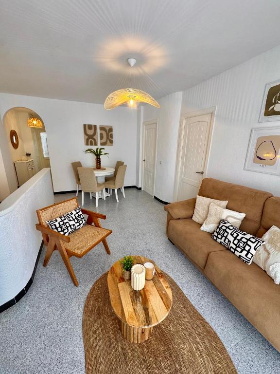 a living room with a couch and a table at Casa en el centro de Nerja- Calle Nueva 21 in Nerja