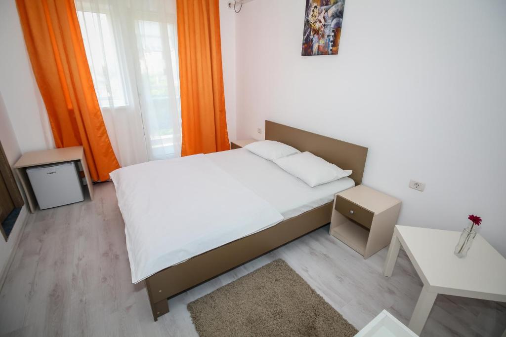 Postel nebo postele na pokoji v ubytování Hotel Atlantis