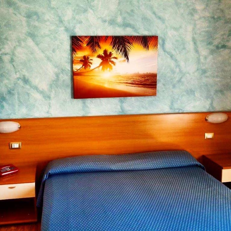 Postel nebo postele na pokoji v ubytování Hotel 2000
