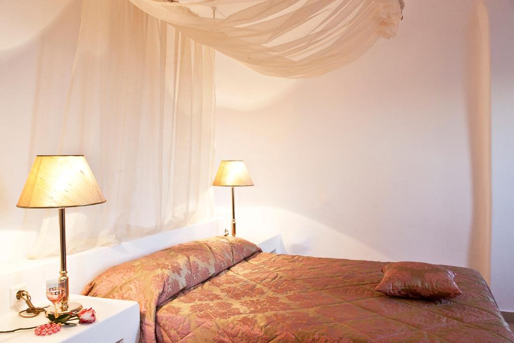 Postel nebo postele na pokoji v ubytování Avianto Suites