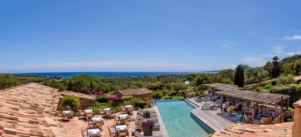 an aerial view of a resort with a swimming pool at Les Bergeries De Palombaggia in Porto-Vecchio