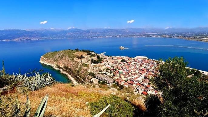 an island in the middle of a large body of water at Amimoni Apartment in Nafplio