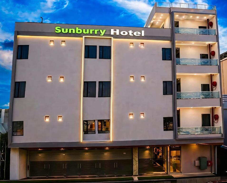 a hotel building with a sunbury hotel sign on it at Sunburry Hotel Khatu 700mts from Temple in Khātu