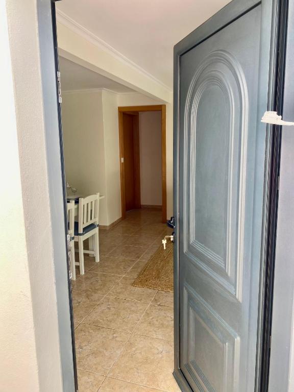 a door leading into a hallway with a dining room at Paraiso do Rio Casa T1 in Mondim de Basto