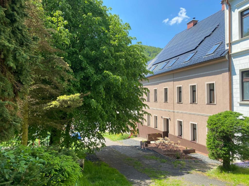 a building with a row of benches next to it at Apartmány Mikulov 45 in Mikulov v Krušných Horách