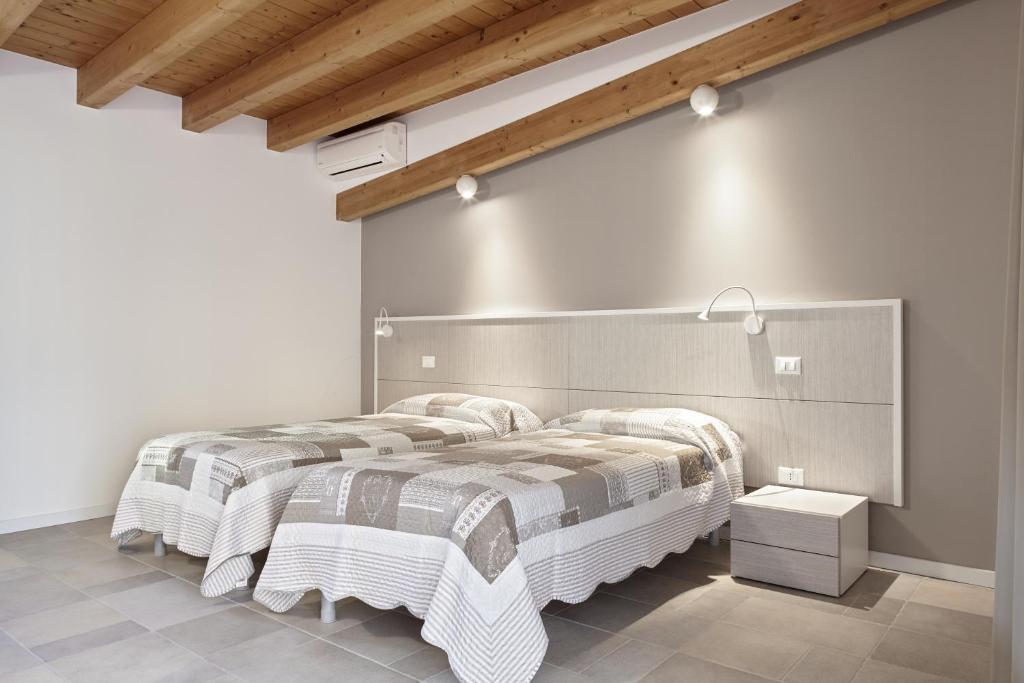 Postel nebo postele na pokoji v ubytování B&B Agorà