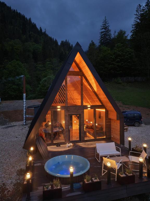 a small house with a pool in front of it at Hyde Retreat in Holda